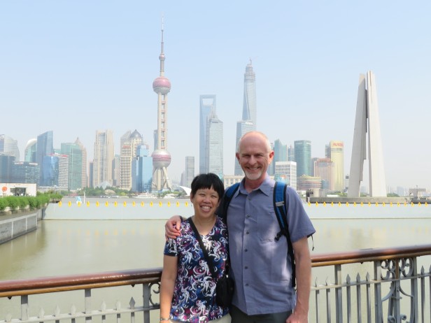 My husband John and I stand near the Bund, with the Shanghai skyscrapers in the background.